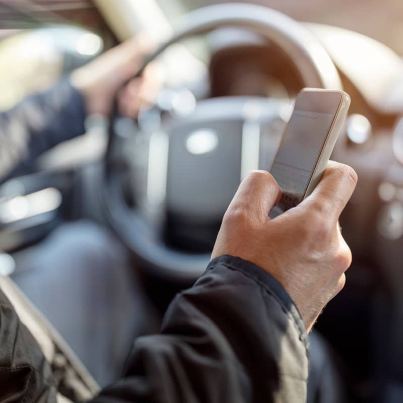Driver texting while driving.