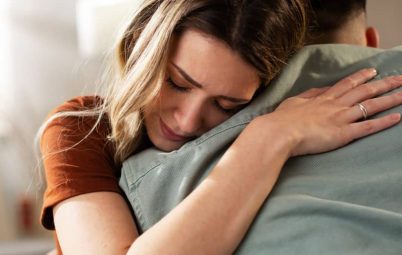 Woman comforting a man.