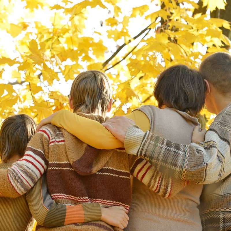 A bereaved family supporting each other.