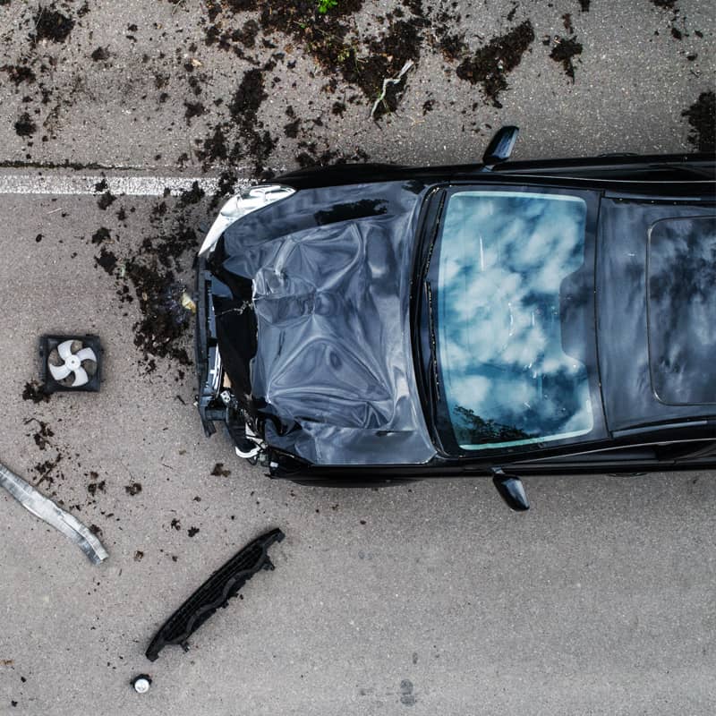 Overhead shot of a damaged car after a road accident.