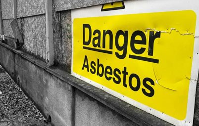Sign warning of the danger of asbestos at a site.