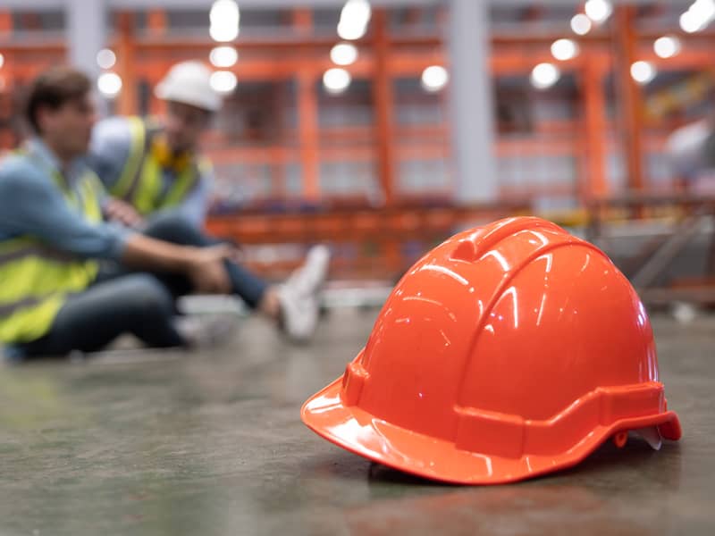Hard hat on the ground following workplace accident.