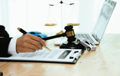 Solicitor filling out an important paperwork document.